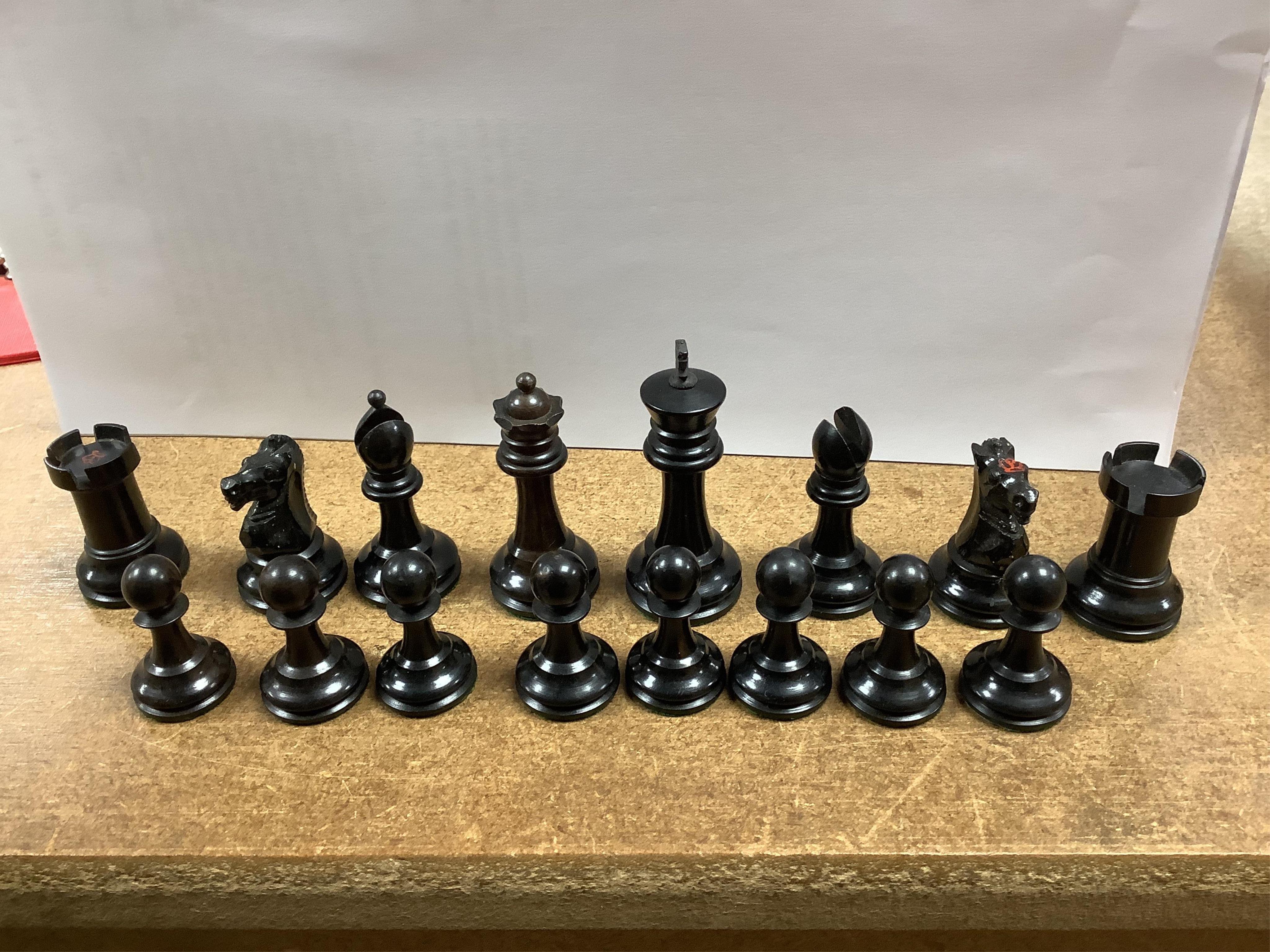 A chess set, possibly F H Ayres, in a mahogany box, and another larger weighted chess set, in box, Ayres Kings 6cm. Condition - good